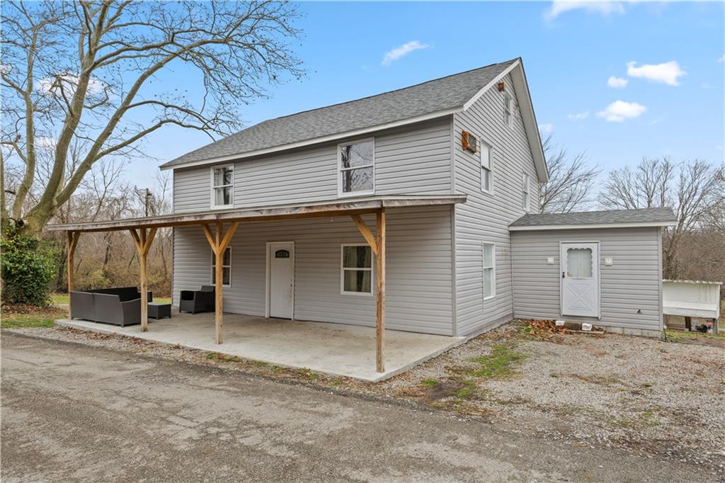 a view of a house with a yard and garage