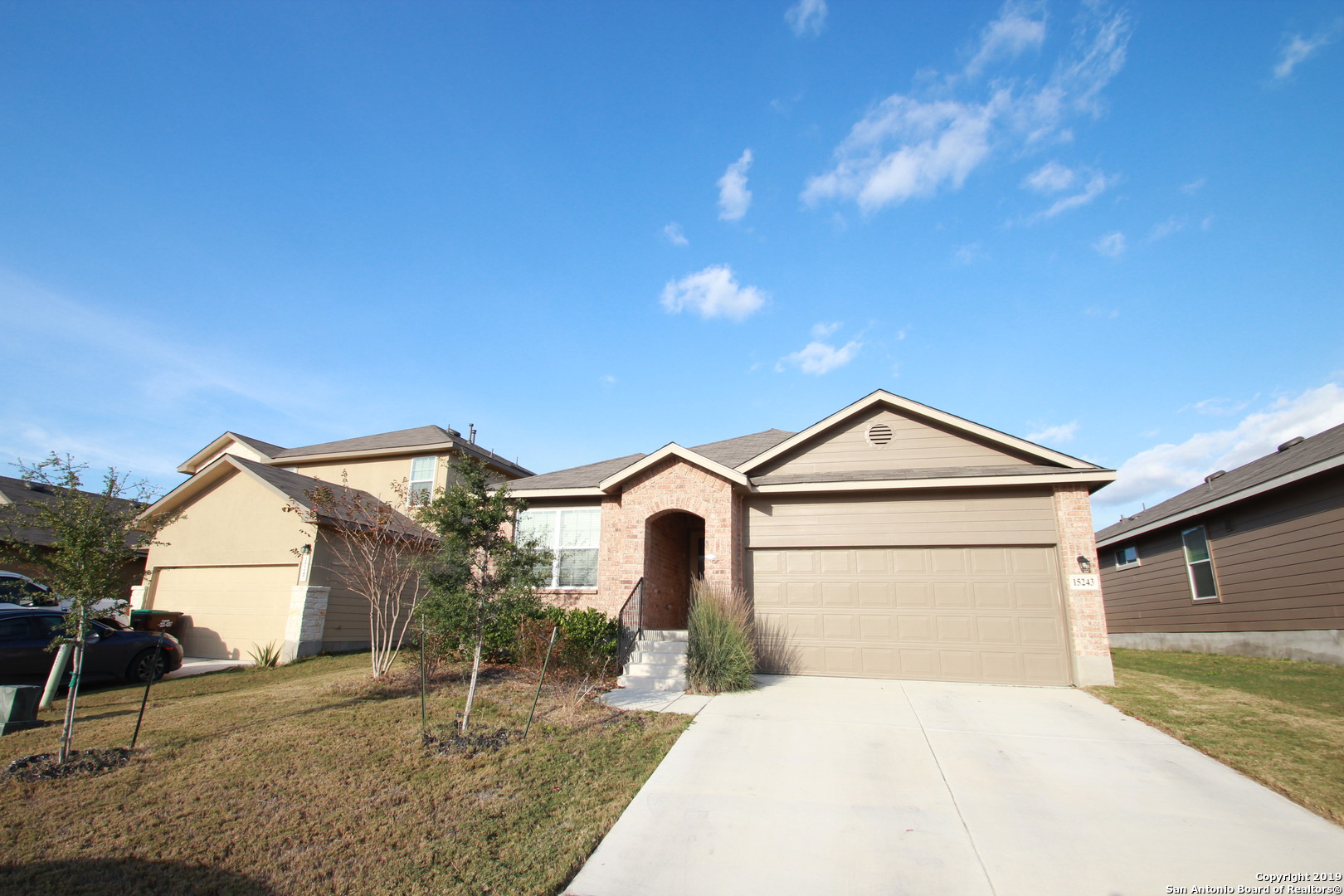 a front view of a house with garden