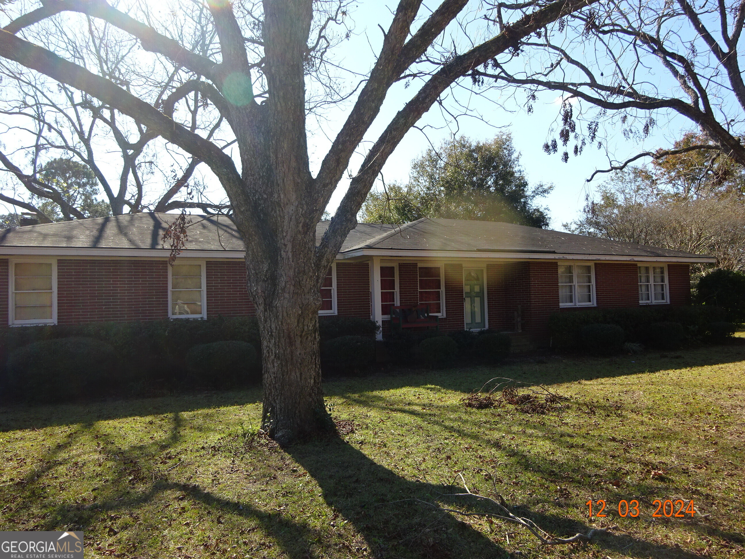 a front view of a house with a yard yard