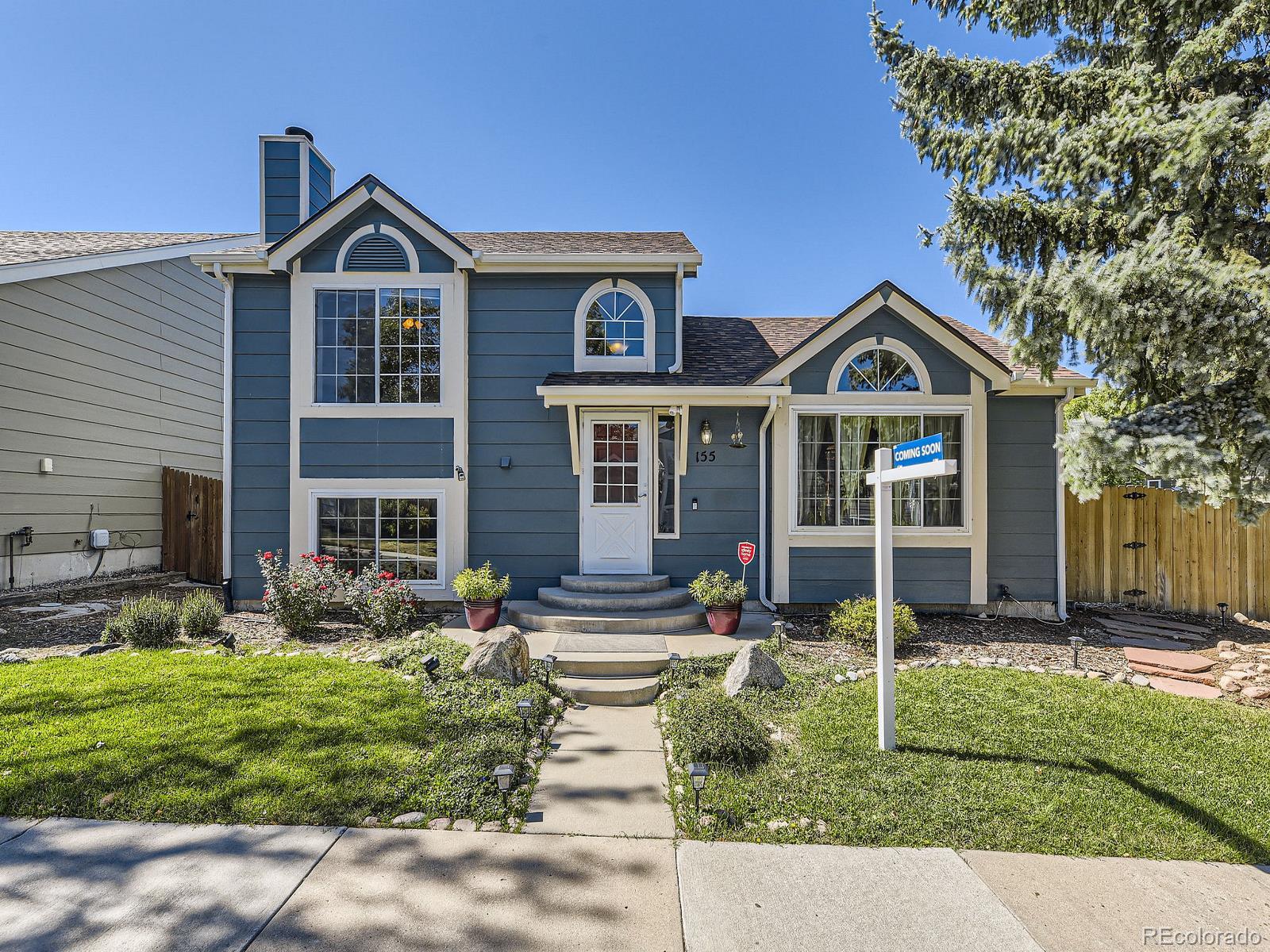 a front view of a house with a yard outdoor seating and yard