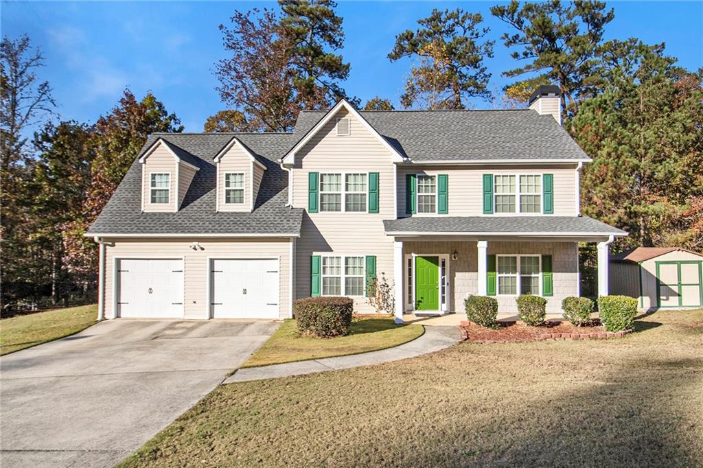 front view of a house with a yard