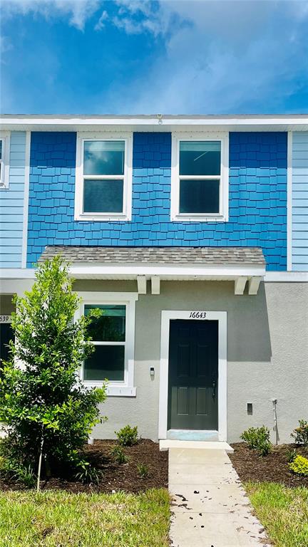 a front view of a house with yard