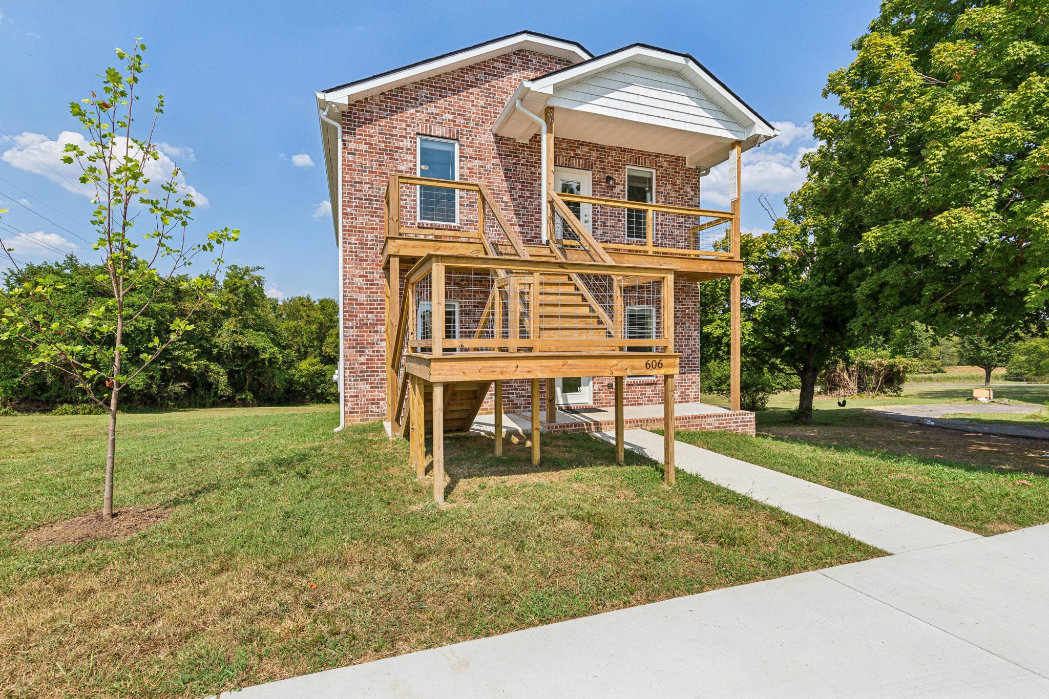 front view of a house with a yard