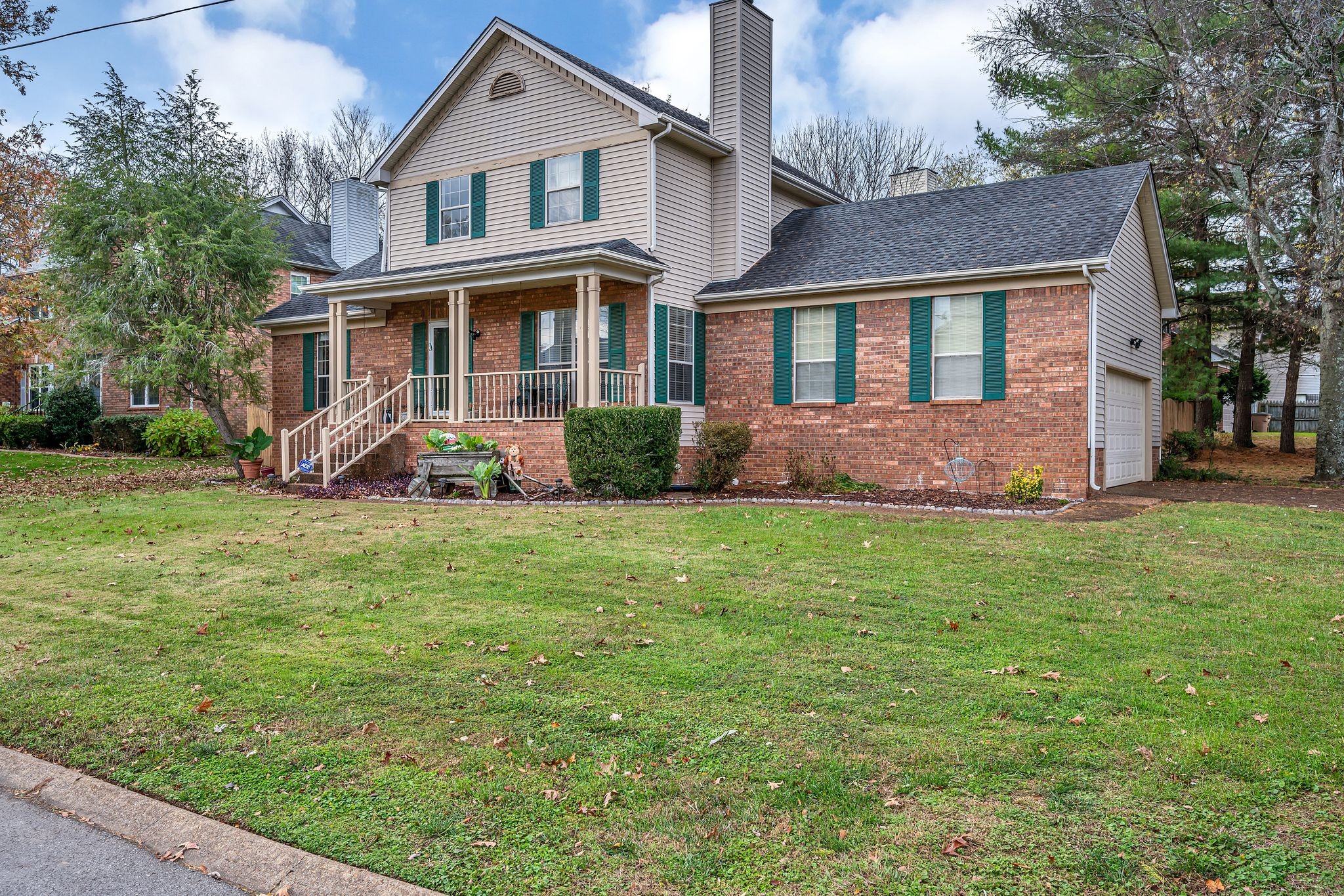 a front view of a house with garden