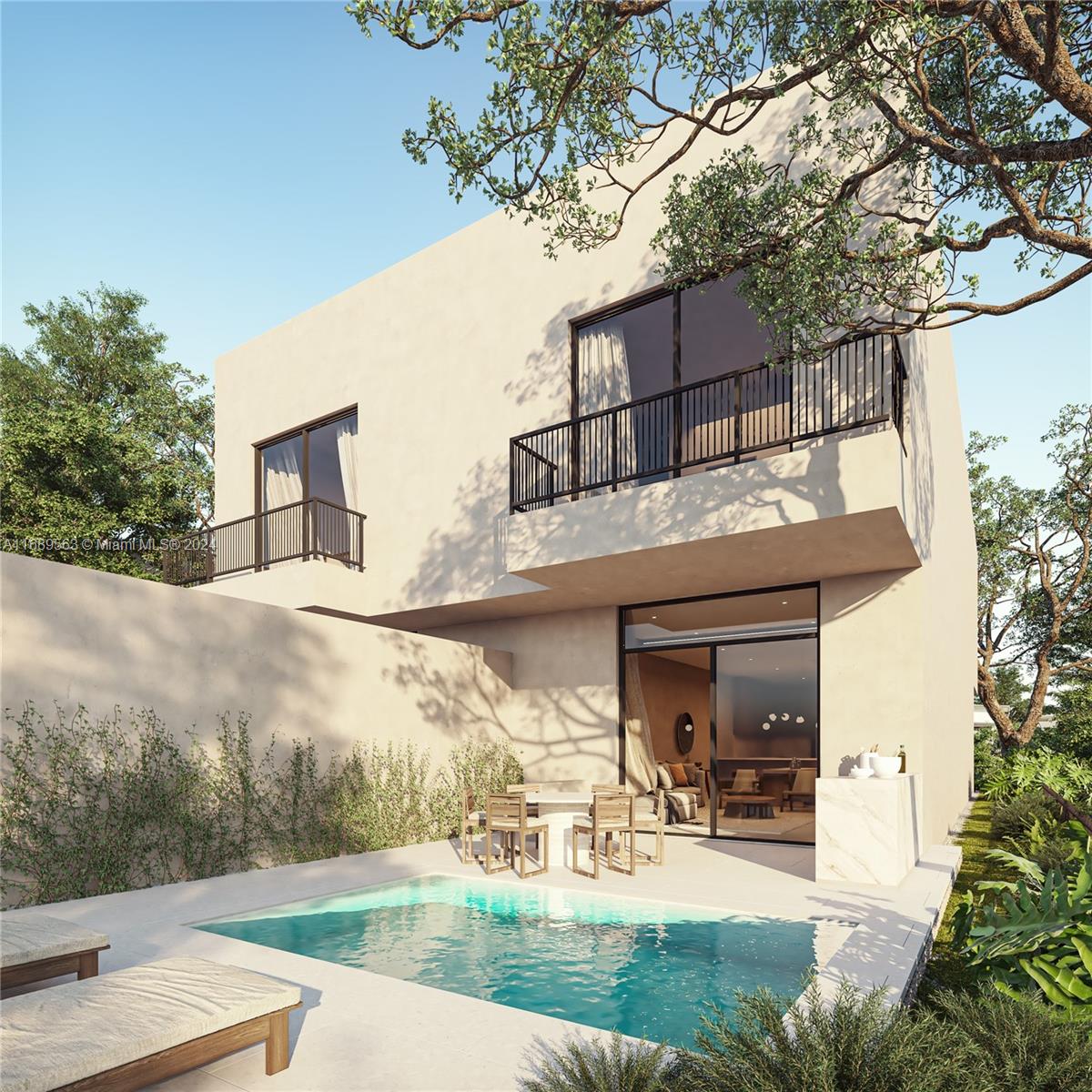 a view of a house with yard and sitting area