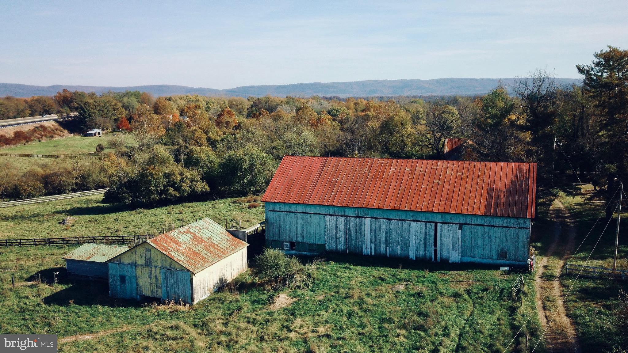 a view of a wooden fence and a yard