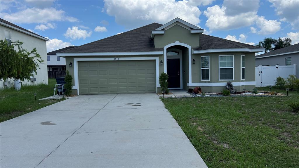 front view of a house with a yard