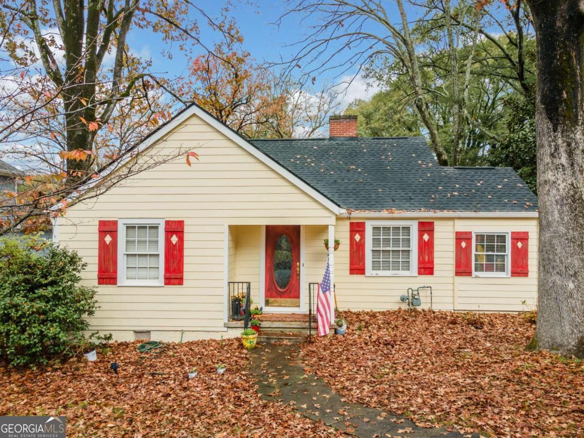 a front view of a house with a small yard