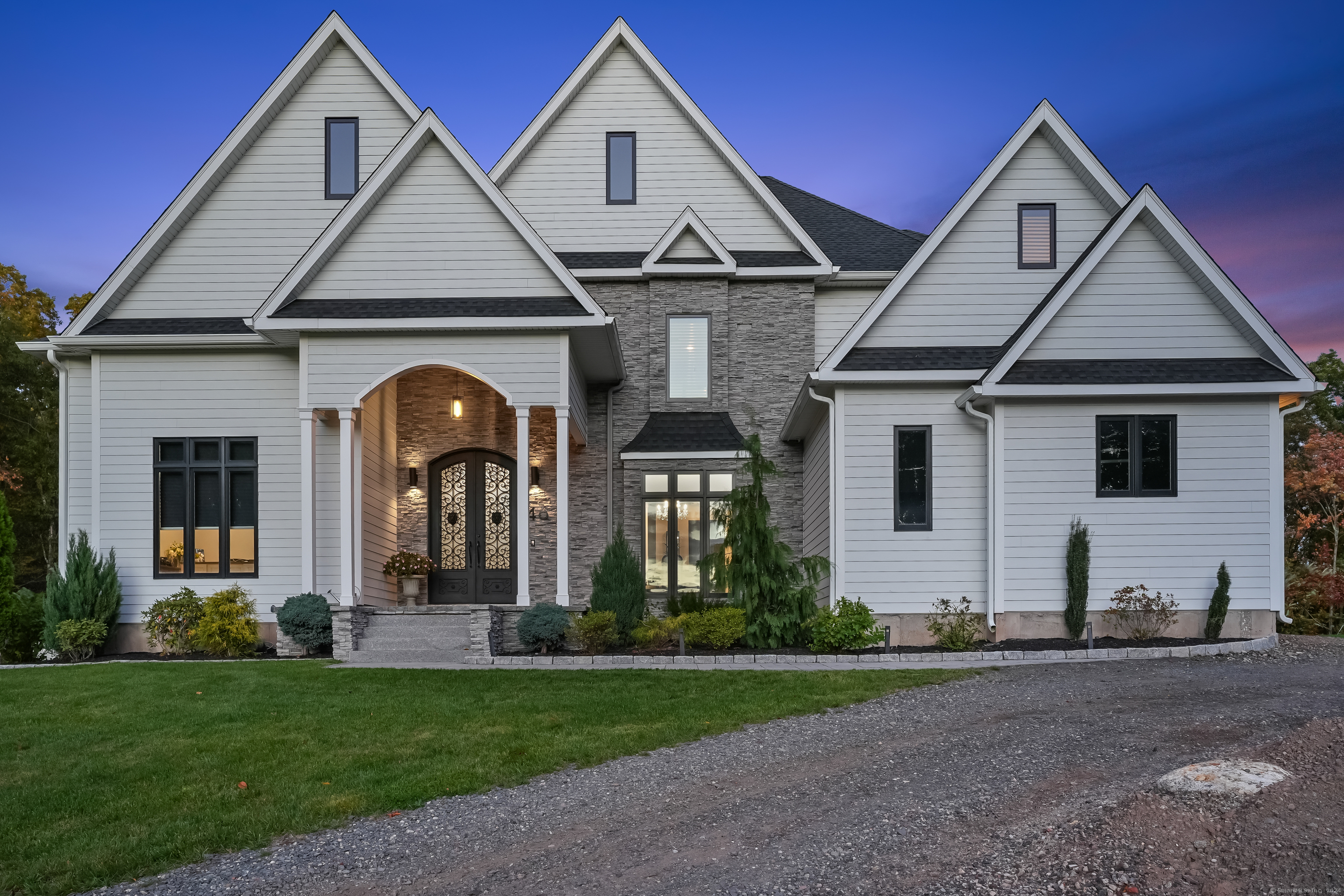 a front view of a house with a yard