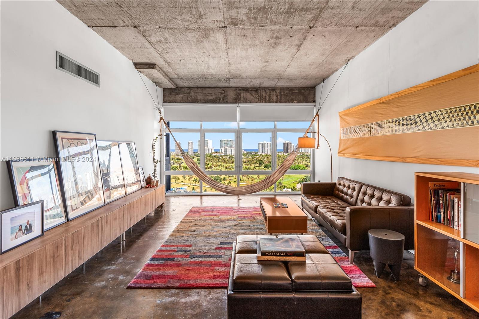 a living room with a couch a table and chairs