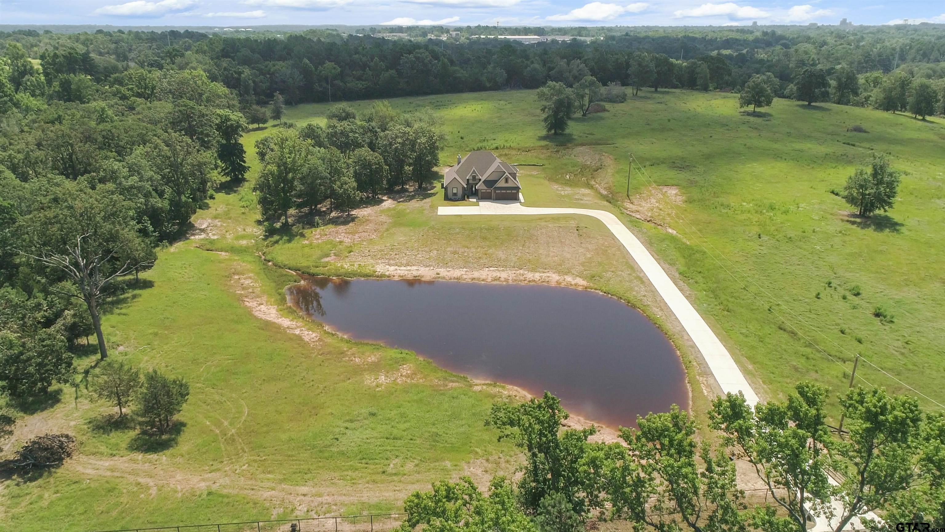 a view of a lake with a yard