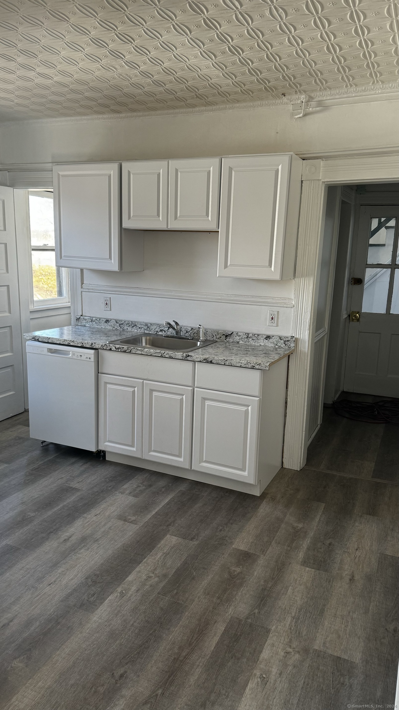 a kitchen with a sink and cabinets