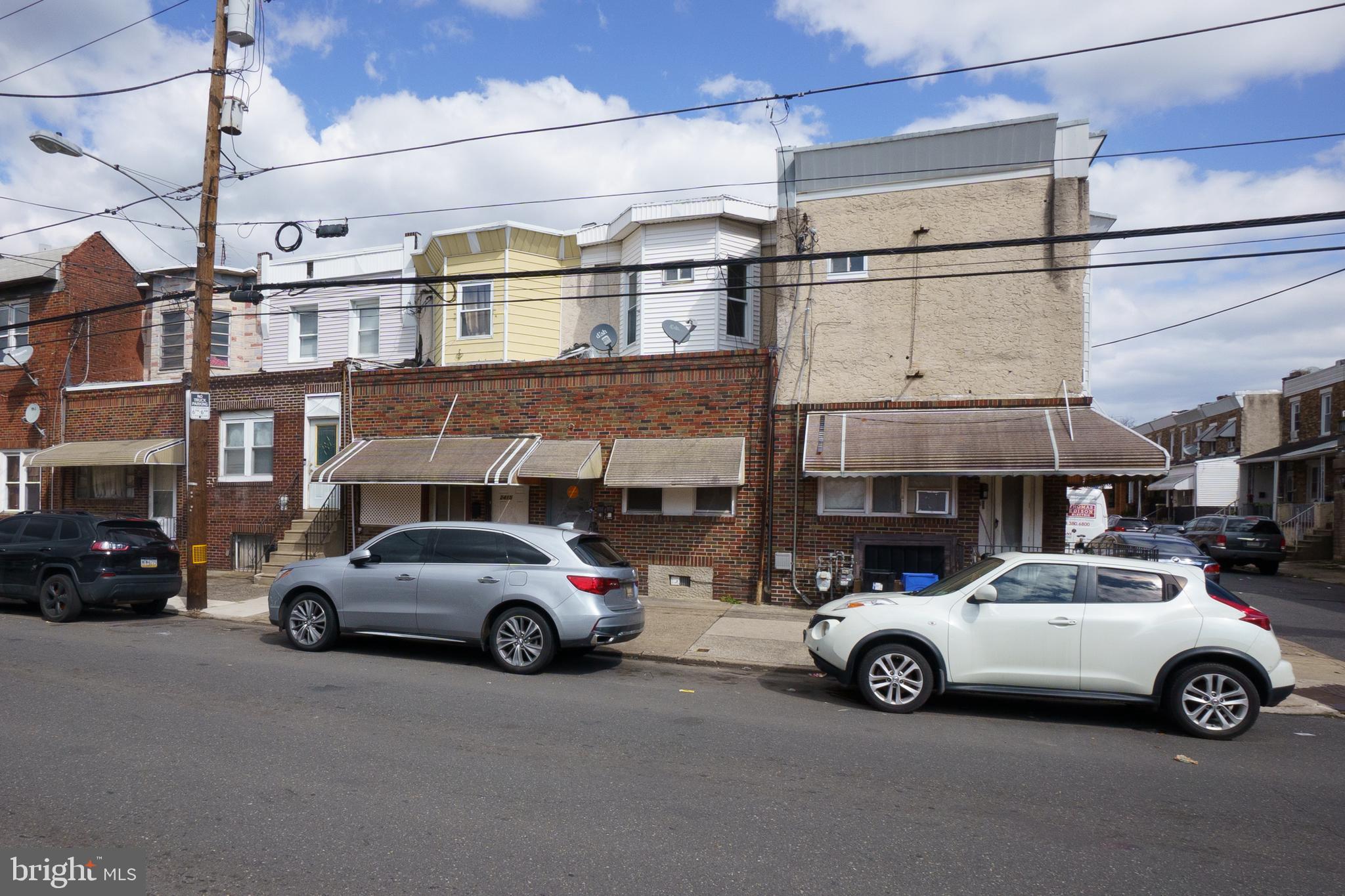 a view of a car parked in front of a building