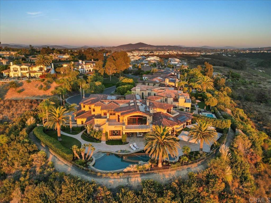 an aerial view of a house with a ocean view