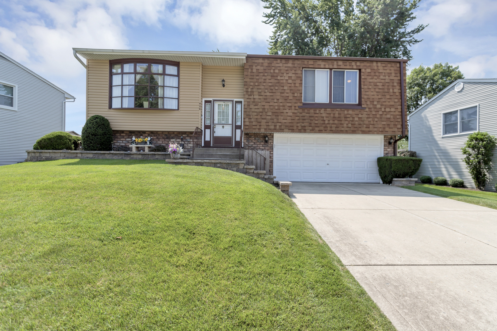 a front view of house with yard and outdoor seating