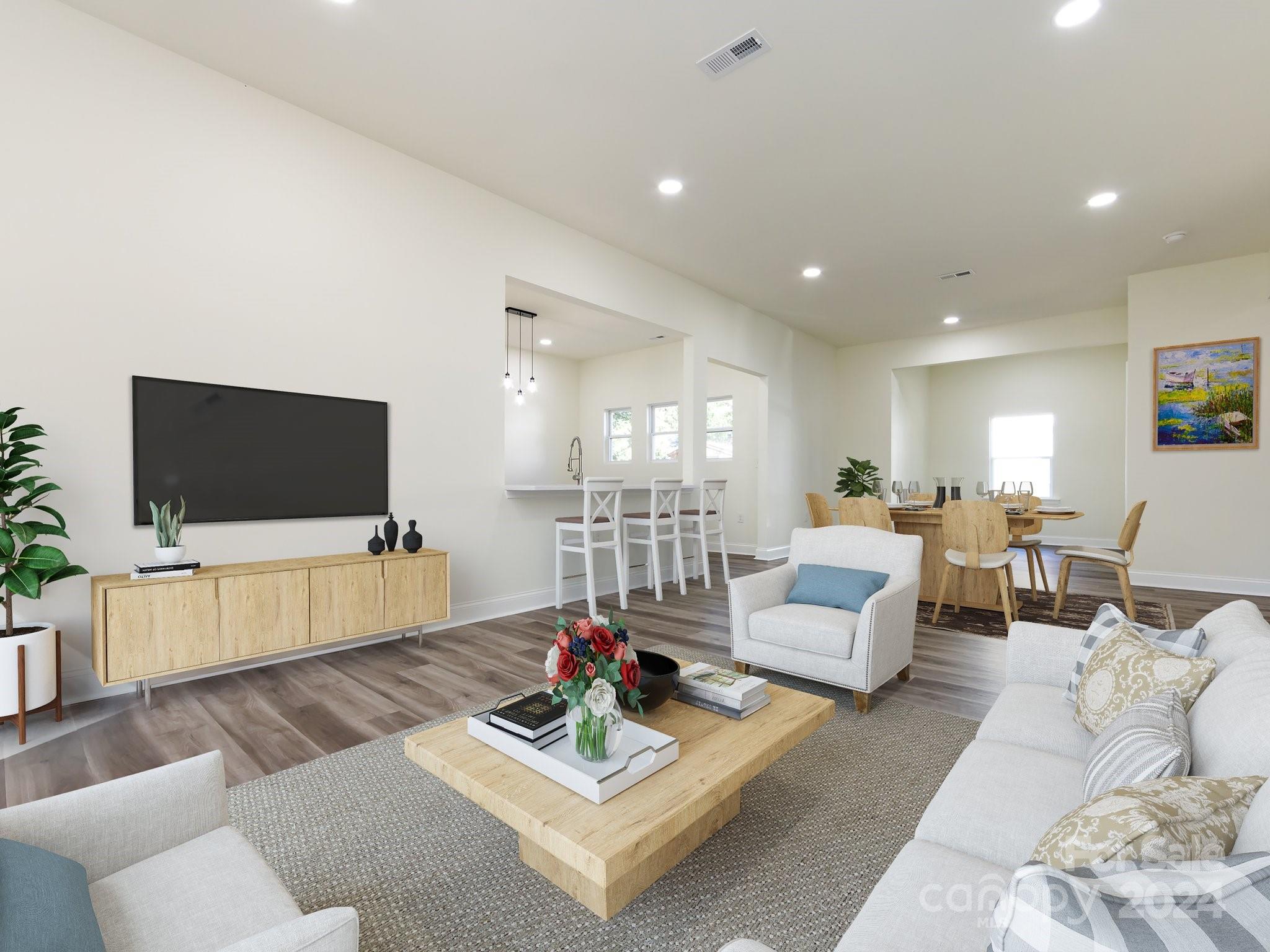 a living room with furniture and a flat screen tv