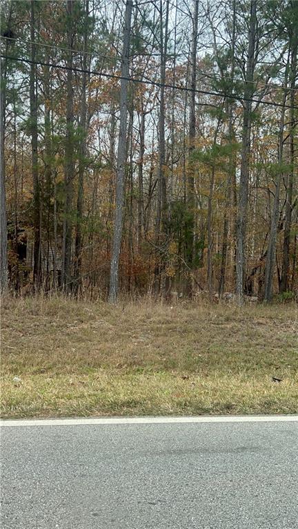 a view of a yard with large trees