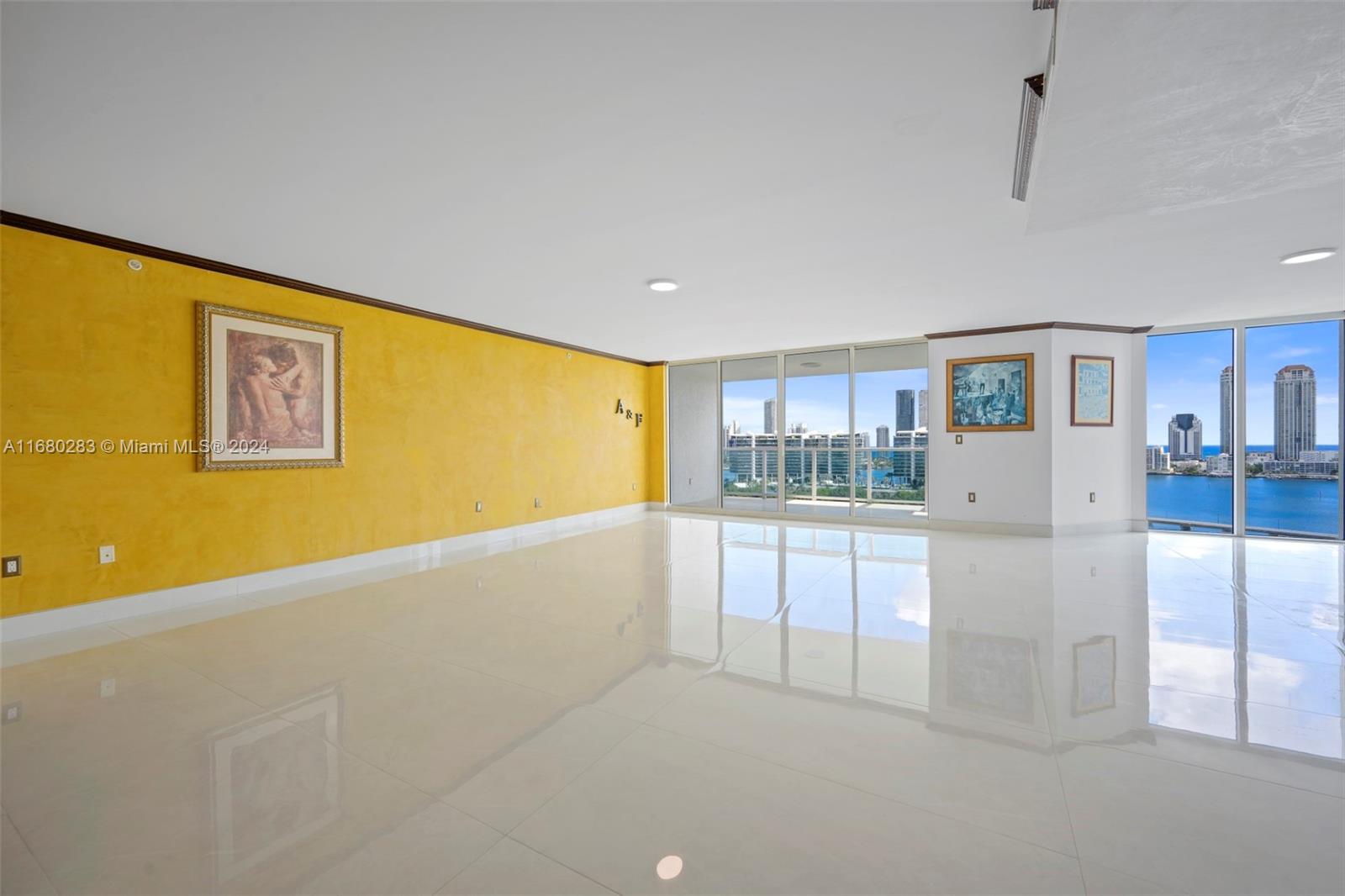 a living room with stainless steel appliances kitchen island granite countertop furniture and a kitchen view