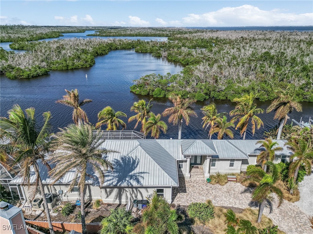 an aerial view of a house with a lake view