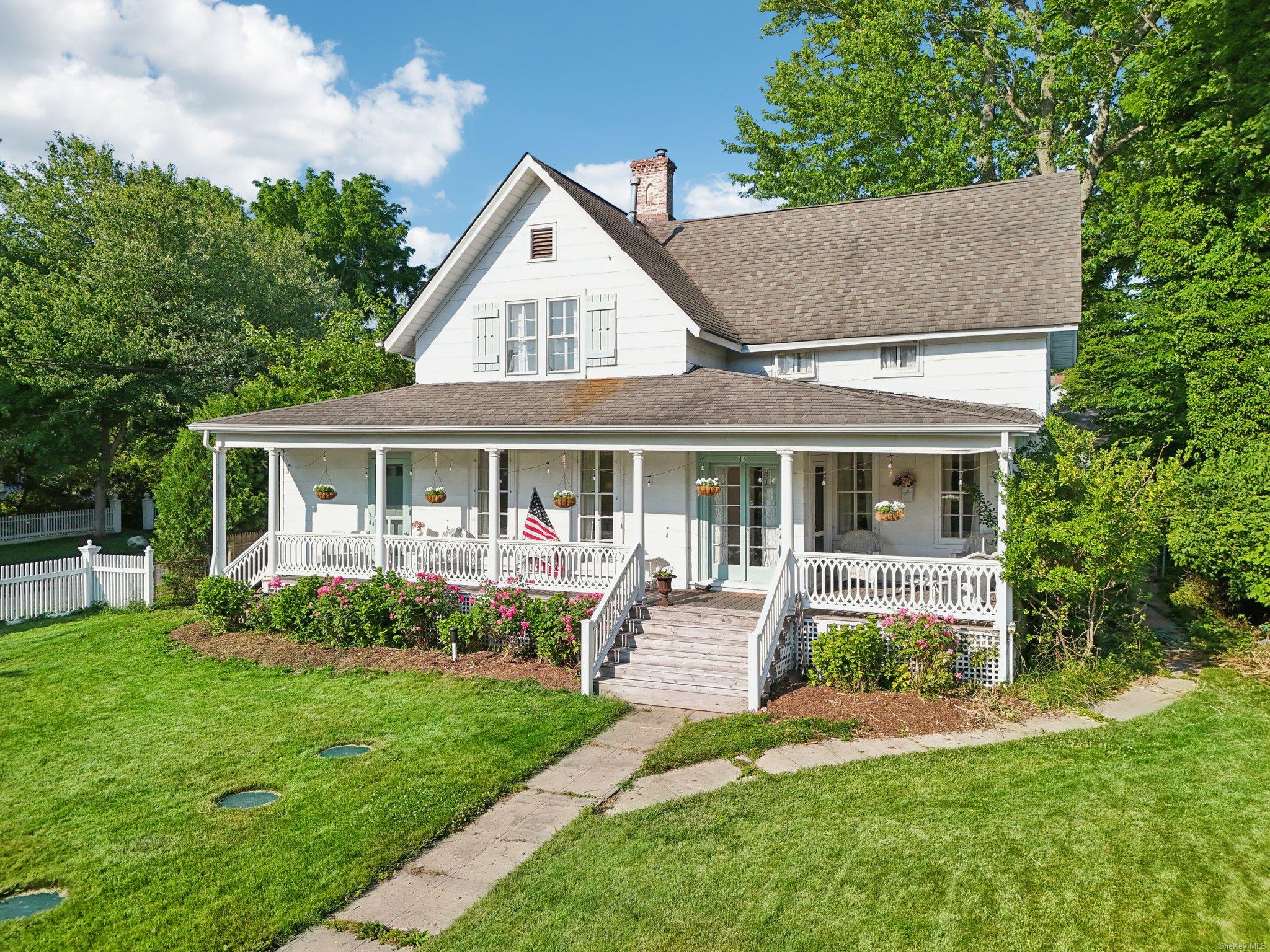 a front view of house with a garden and patio