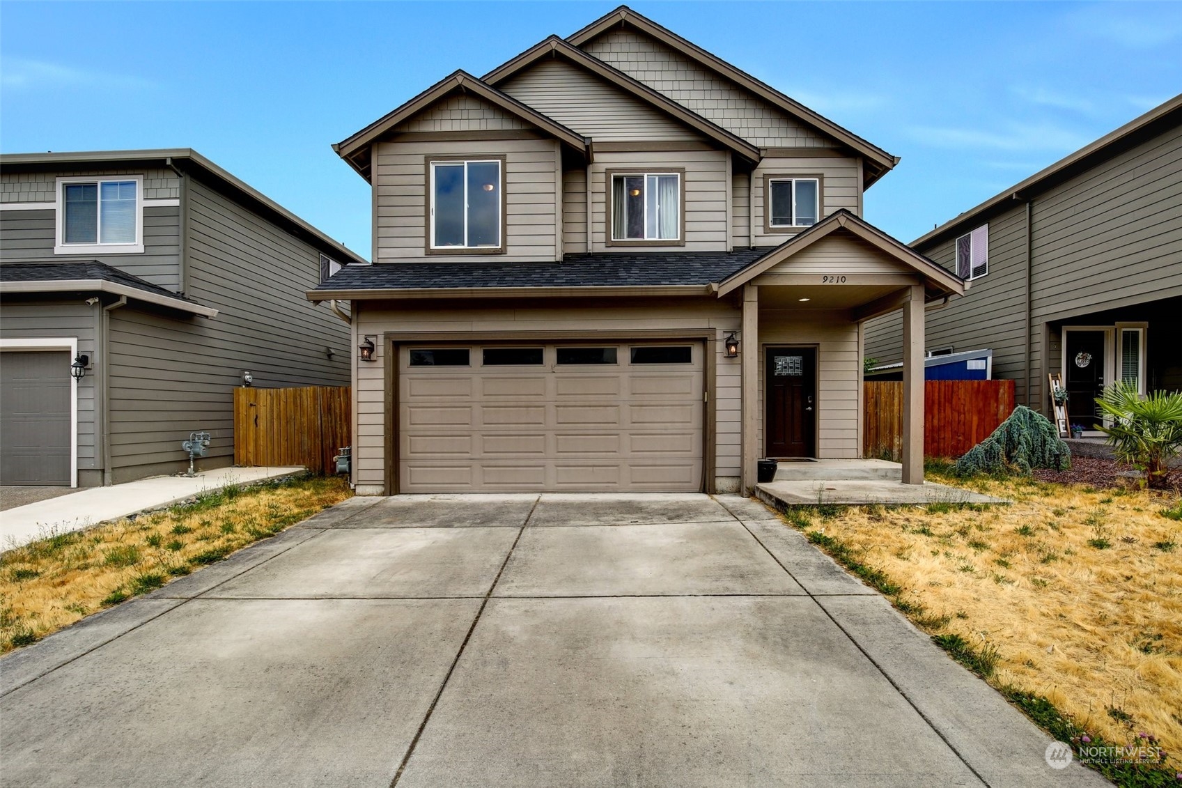 a front view of a house with a garage