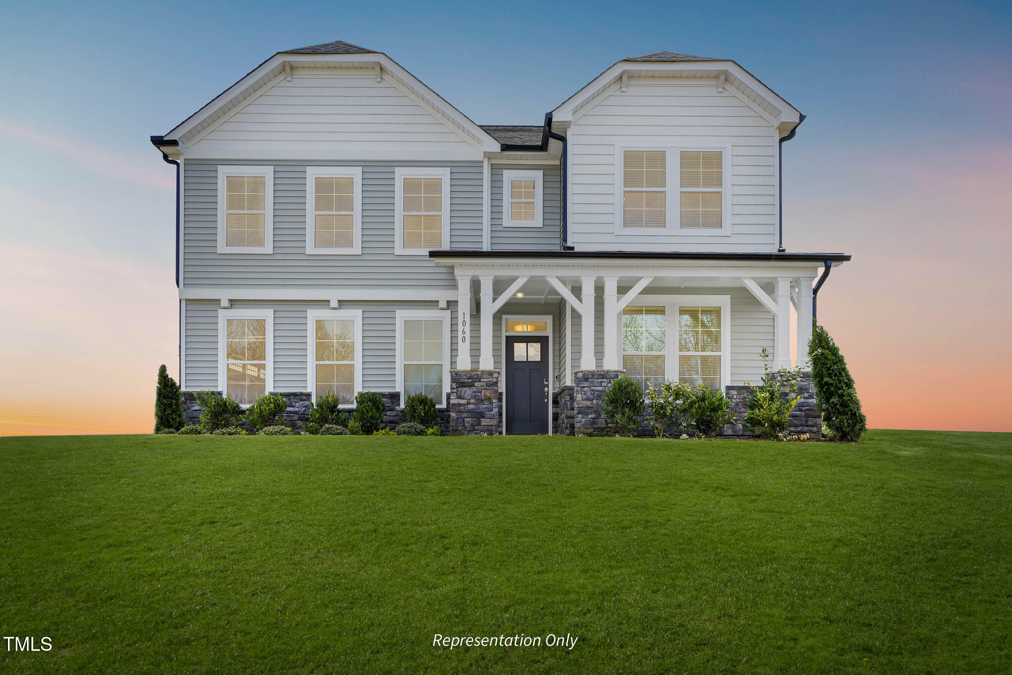 front view of a house with a yard