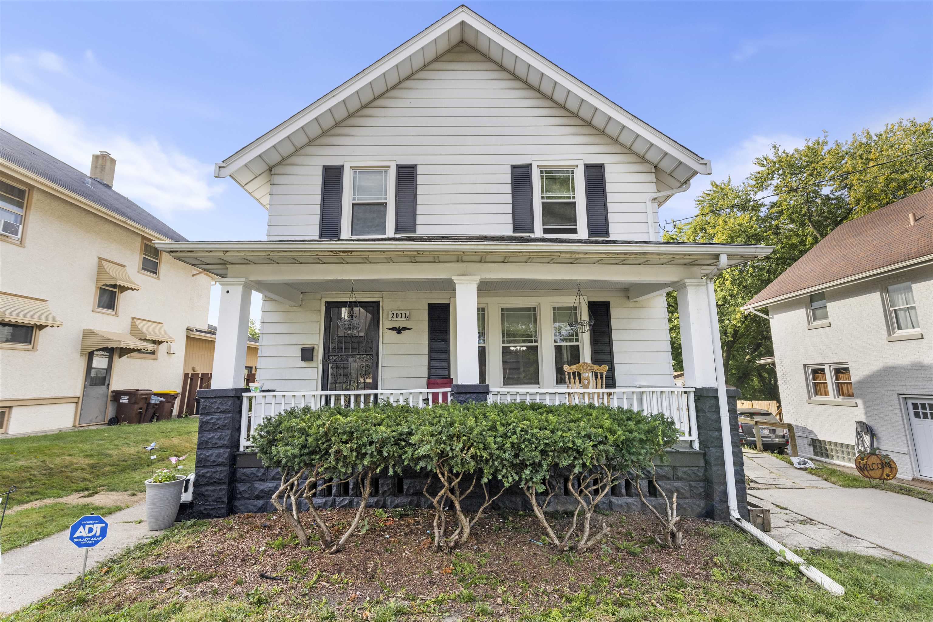 a front view of a house with garden