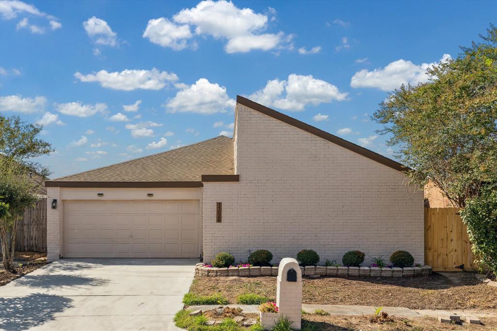 a front view of a house with yard