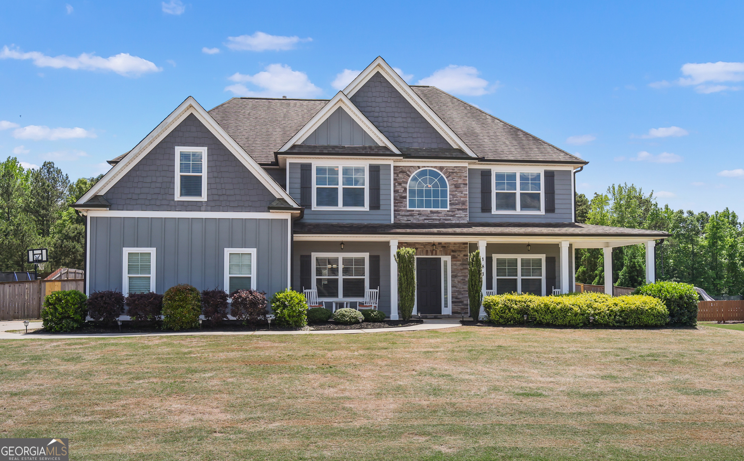 a front view of a house with a yard