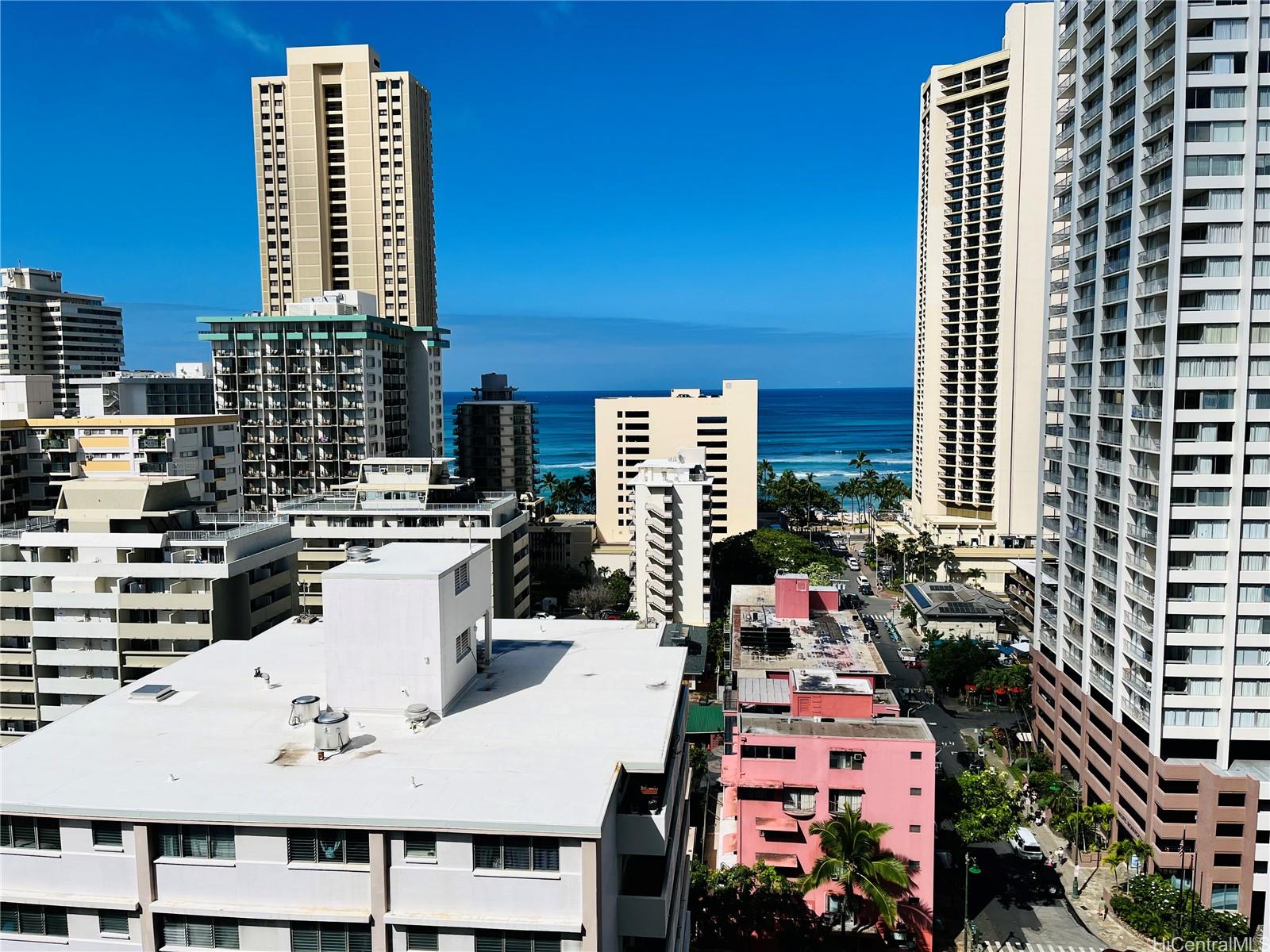 a roof deck with tall buildings