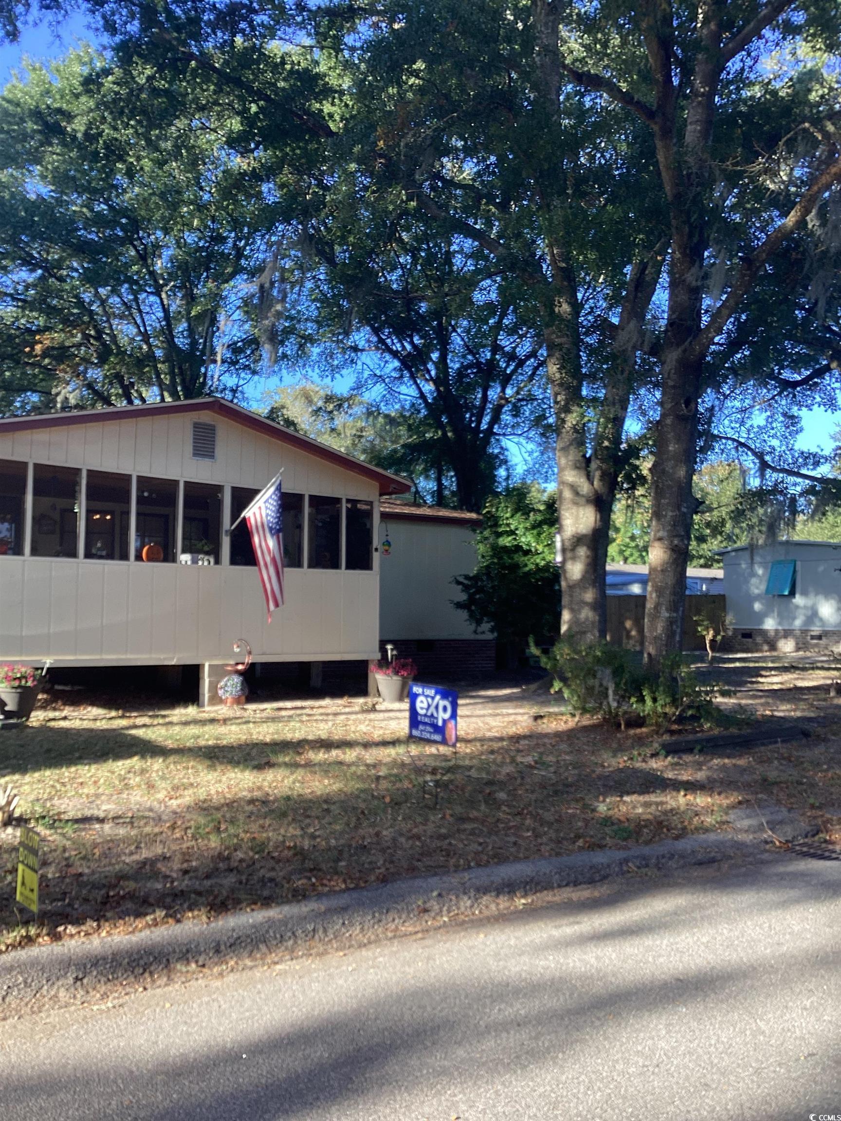 View of front of property with a sunroom