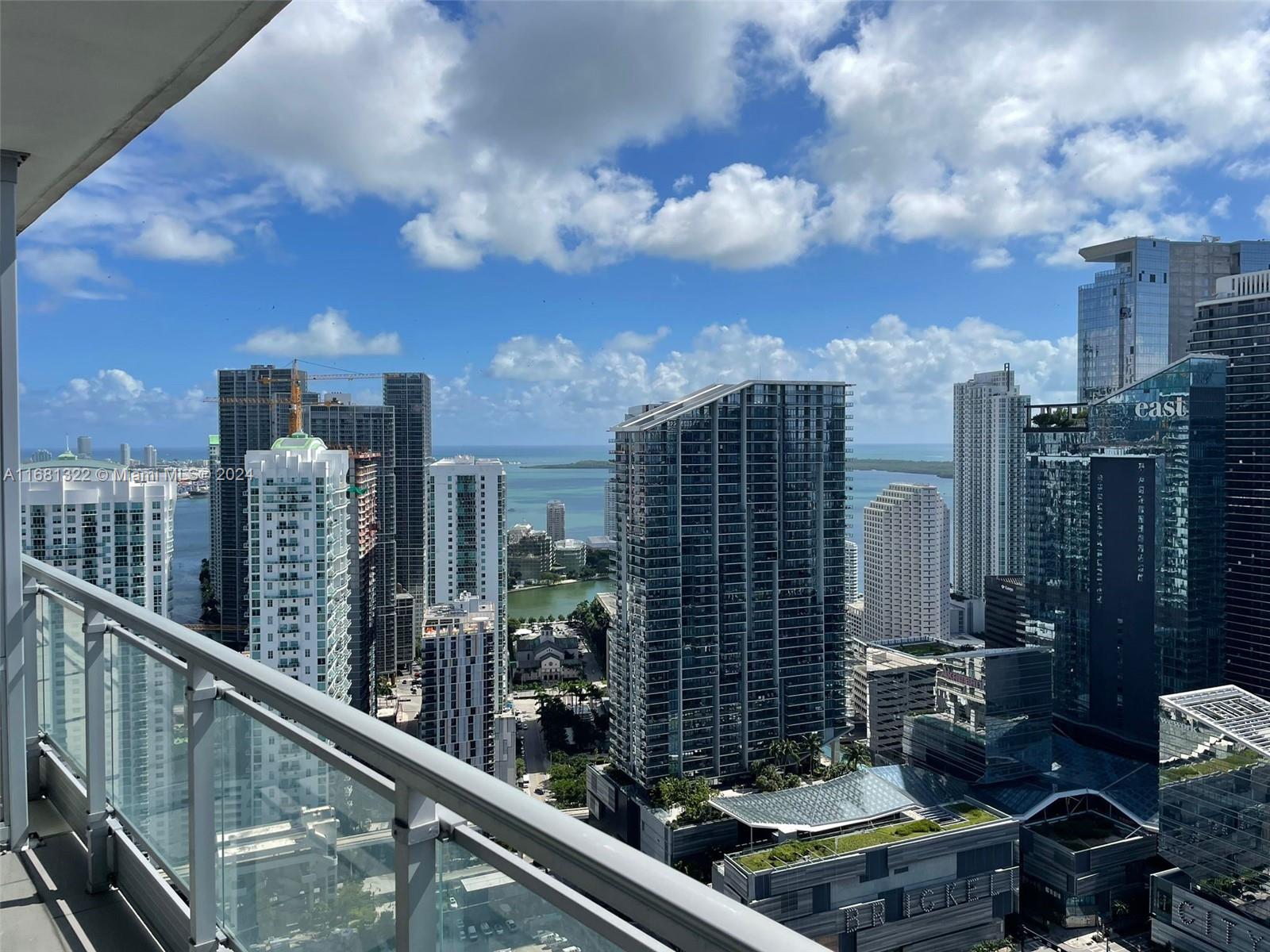 a view of a balcony with city view