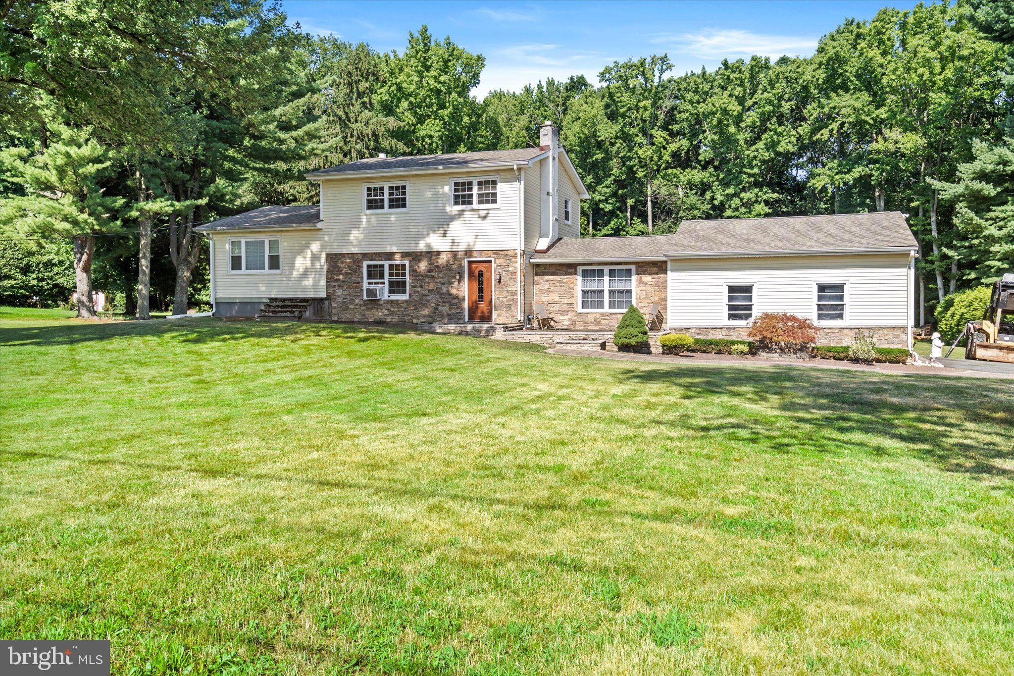 front view of a house with a big yard