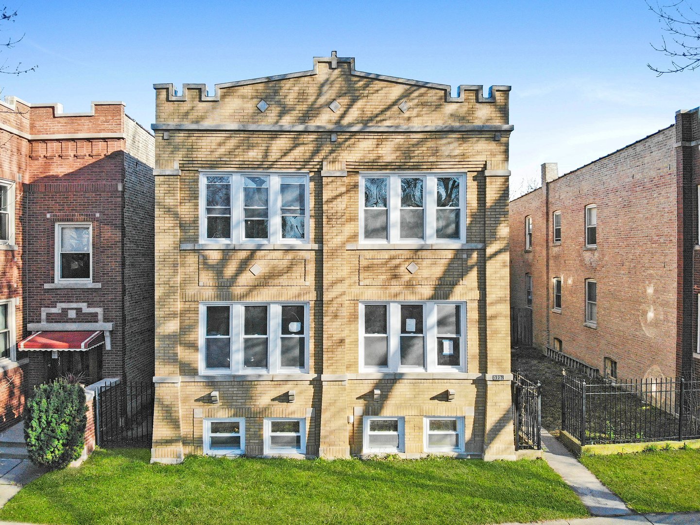 a view of a building with a yard