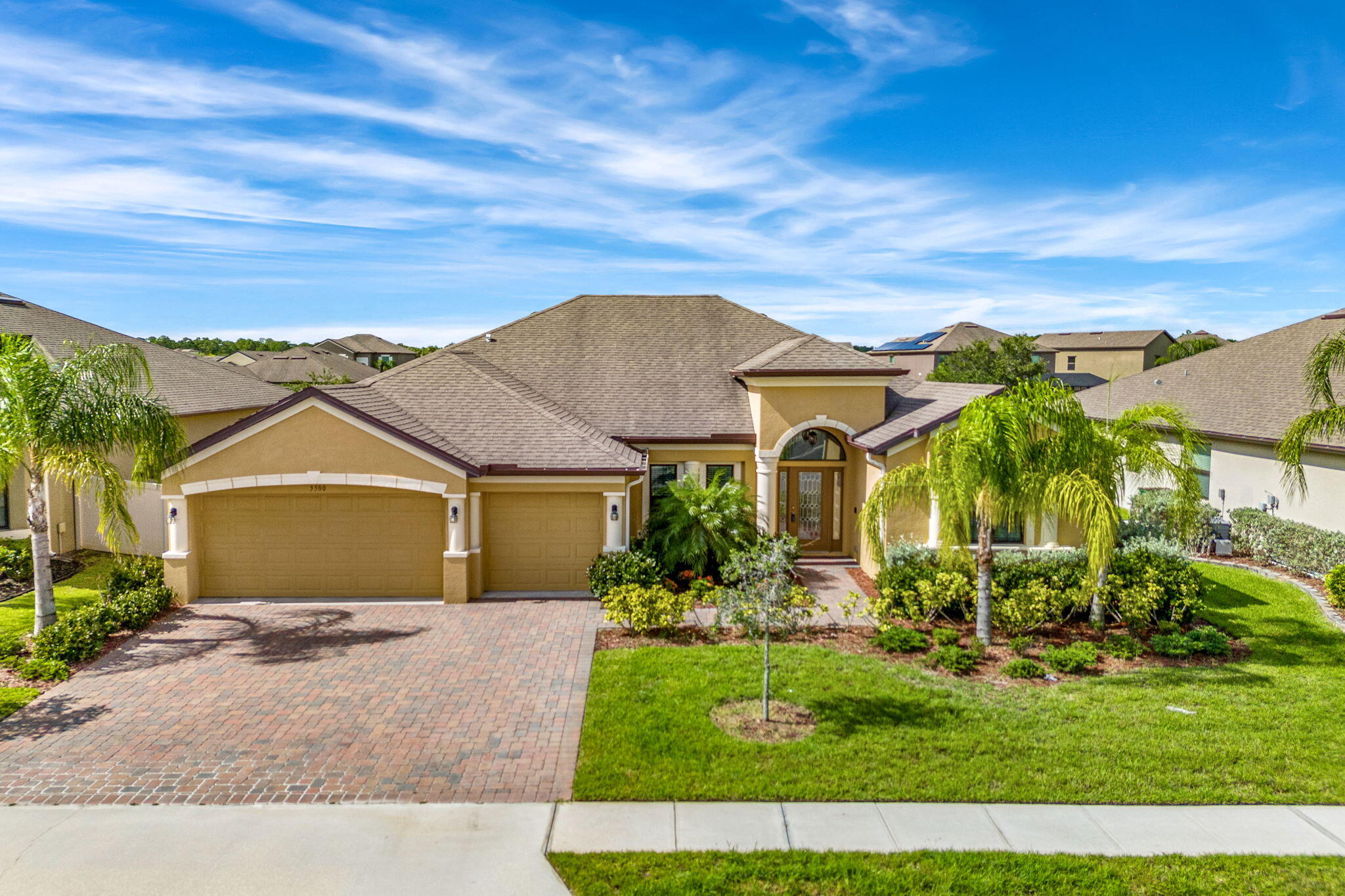 front view of a house with a yard