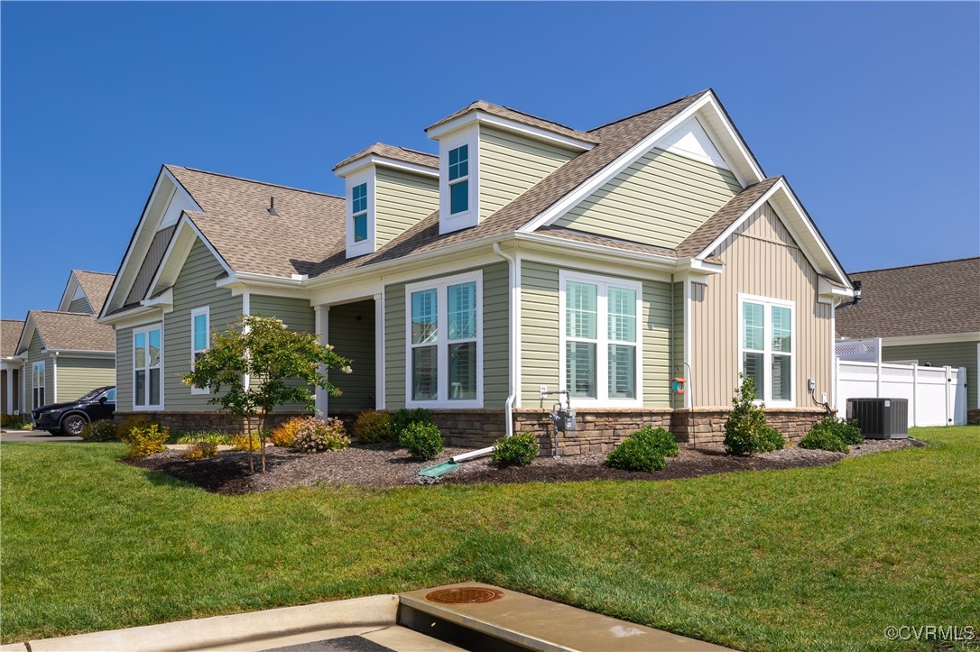 a view of a house with backyard sitting area and garden