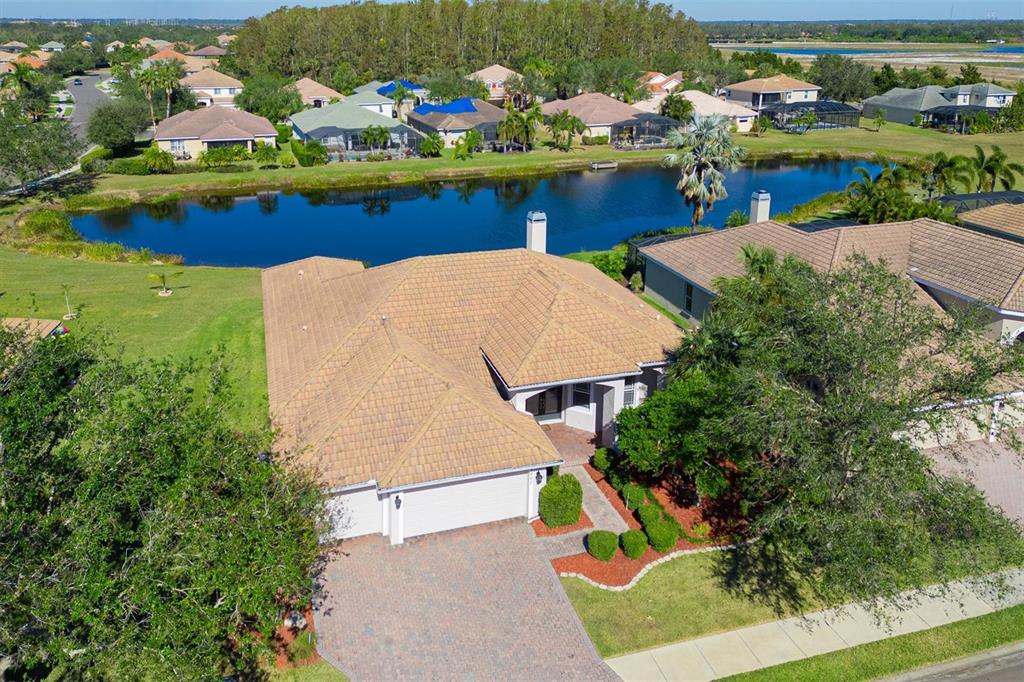 an aerial view of a house with a yard