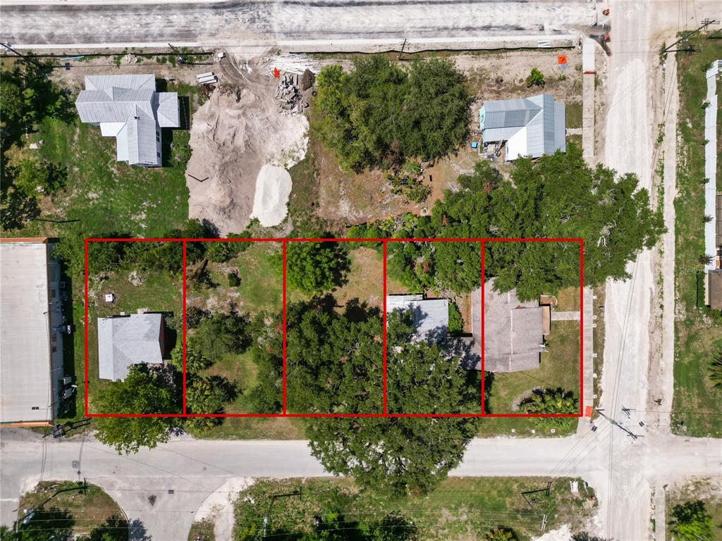 an aerial view of a house with a yard and garden