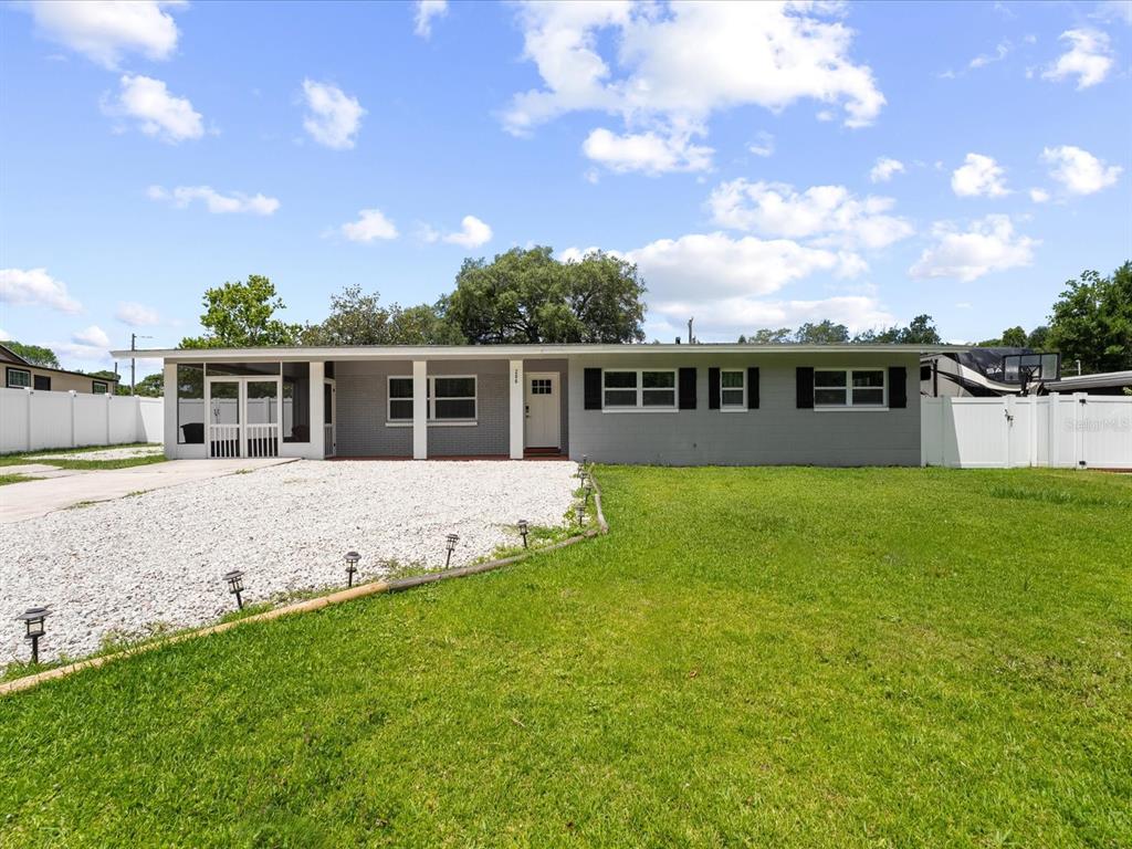 a view of house with a big yard