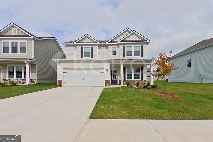 front view of a house with a yard