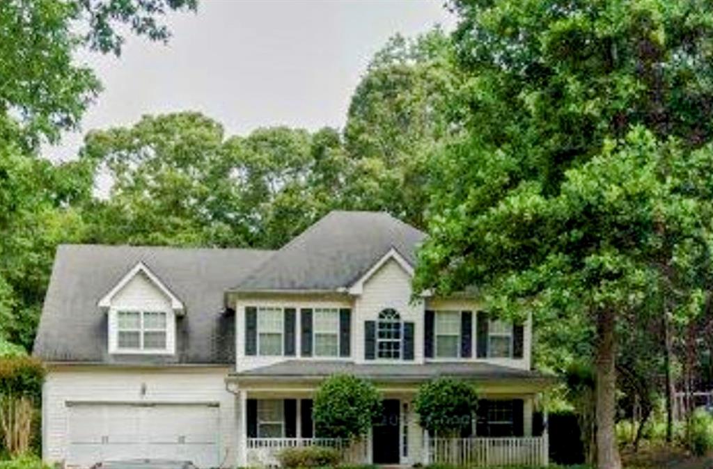 front view of a house with a yard