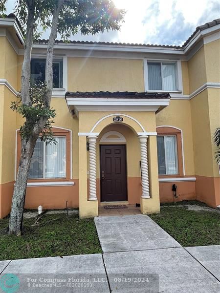 a view of a house with a garden