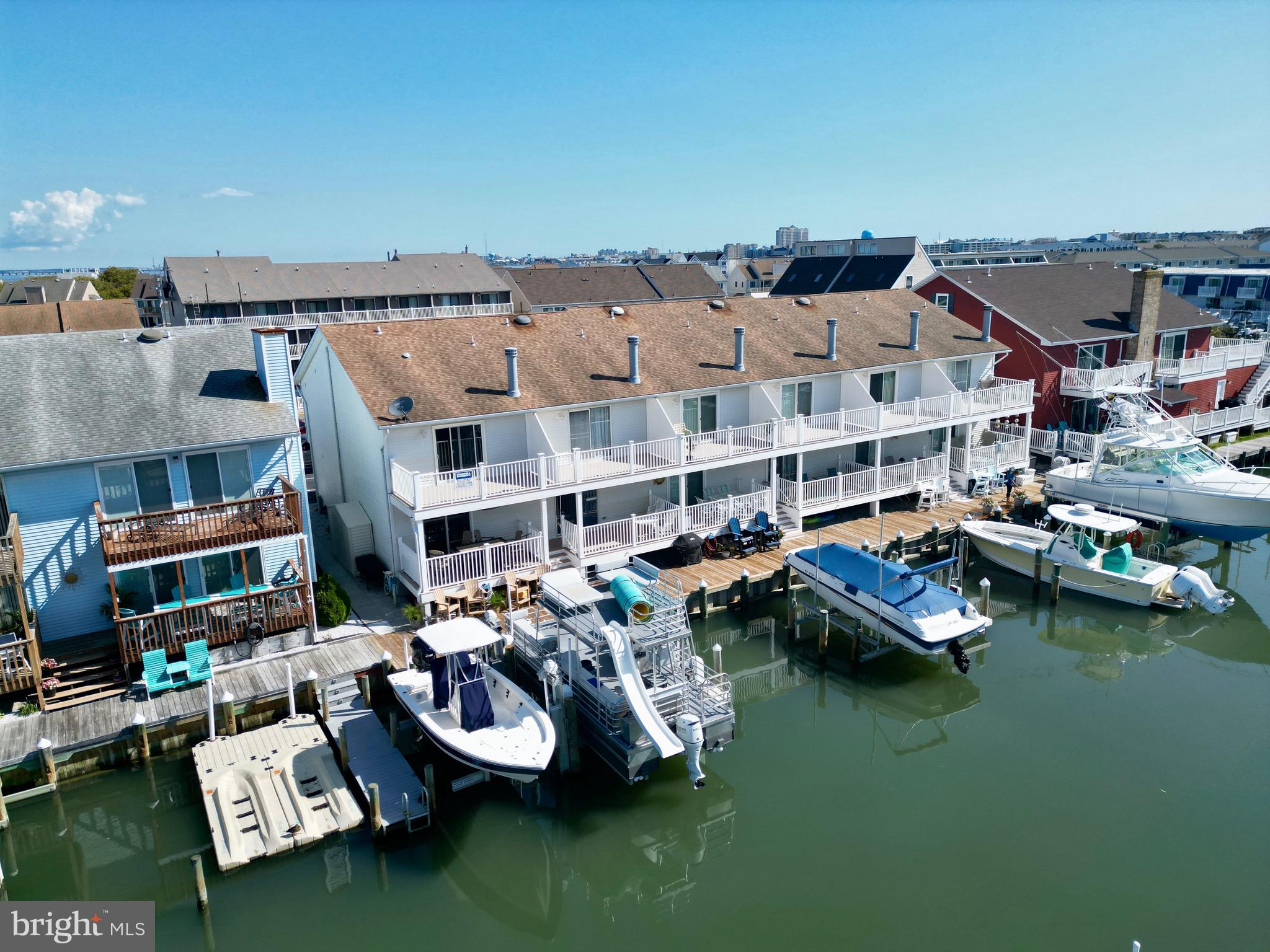 a view of a lake with multiple house