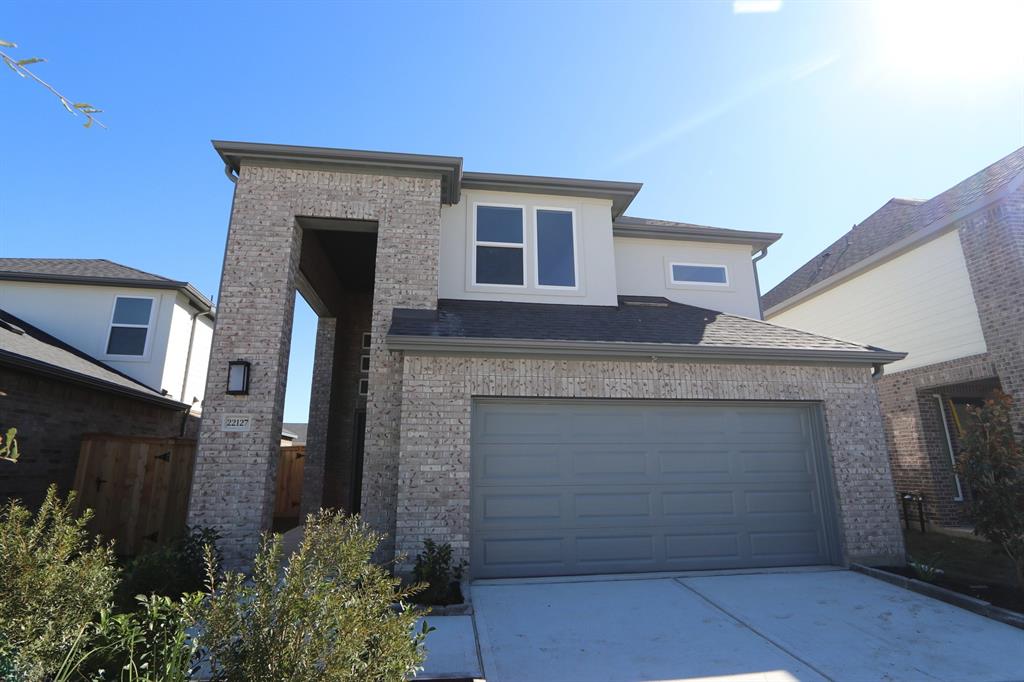 a front view of a house with garage