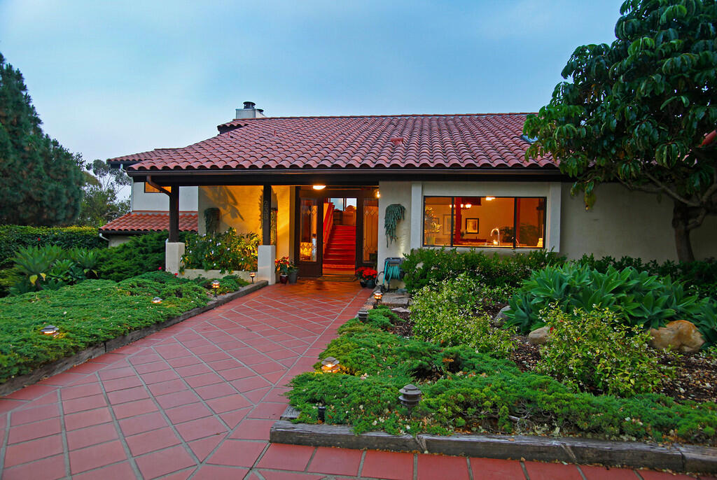 a house view with a garden space