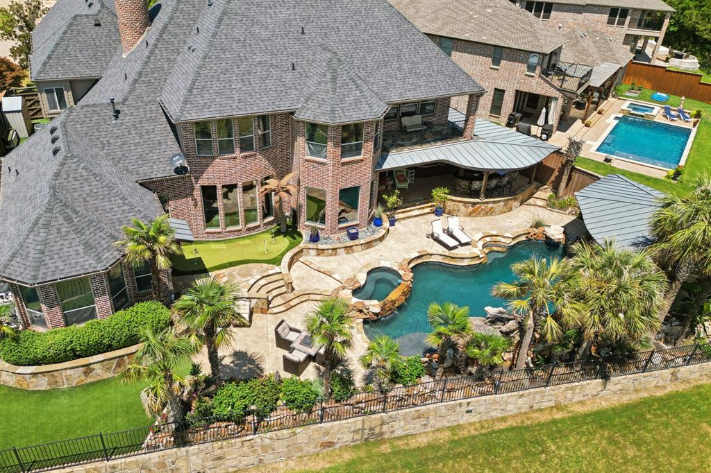 an aerial view of a house with garden space and outdoor seating