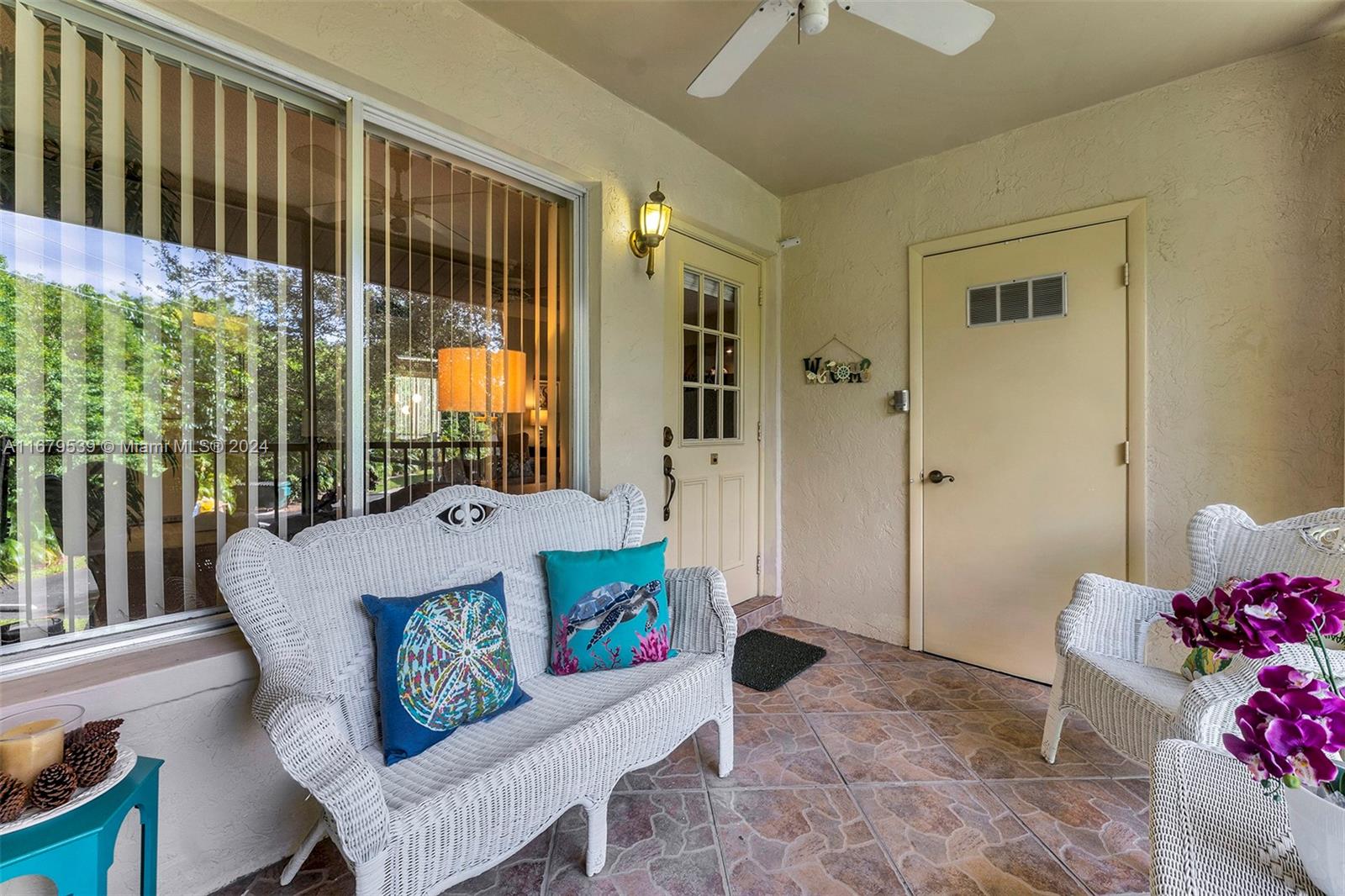 a living room with a couch and a dining table