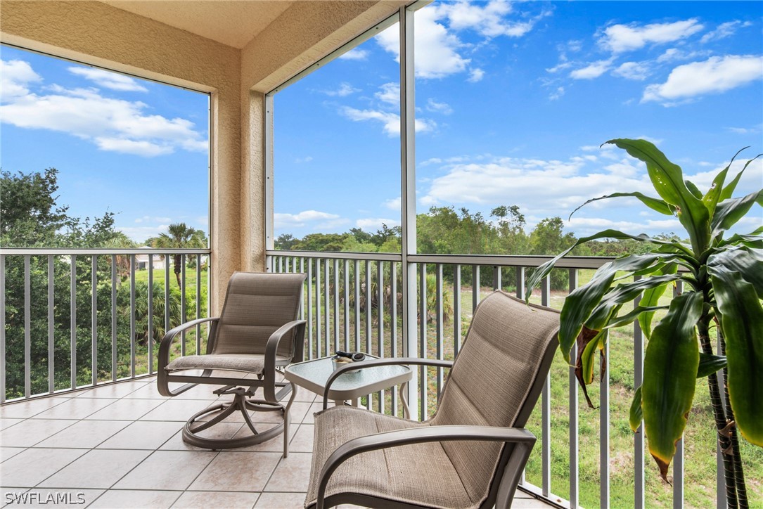 a view of balcony with furniture