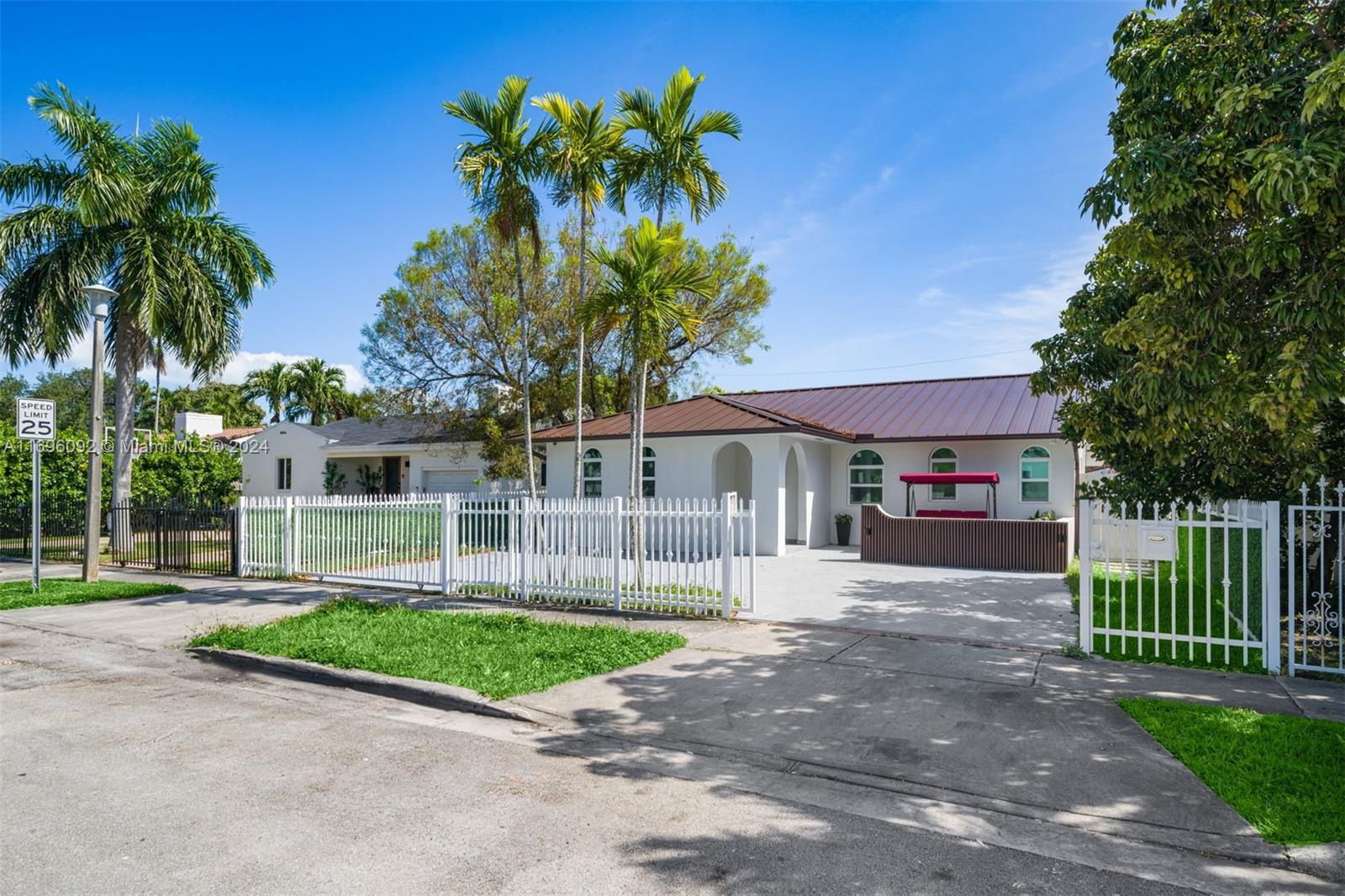 a front view of a house with a yard and a garage