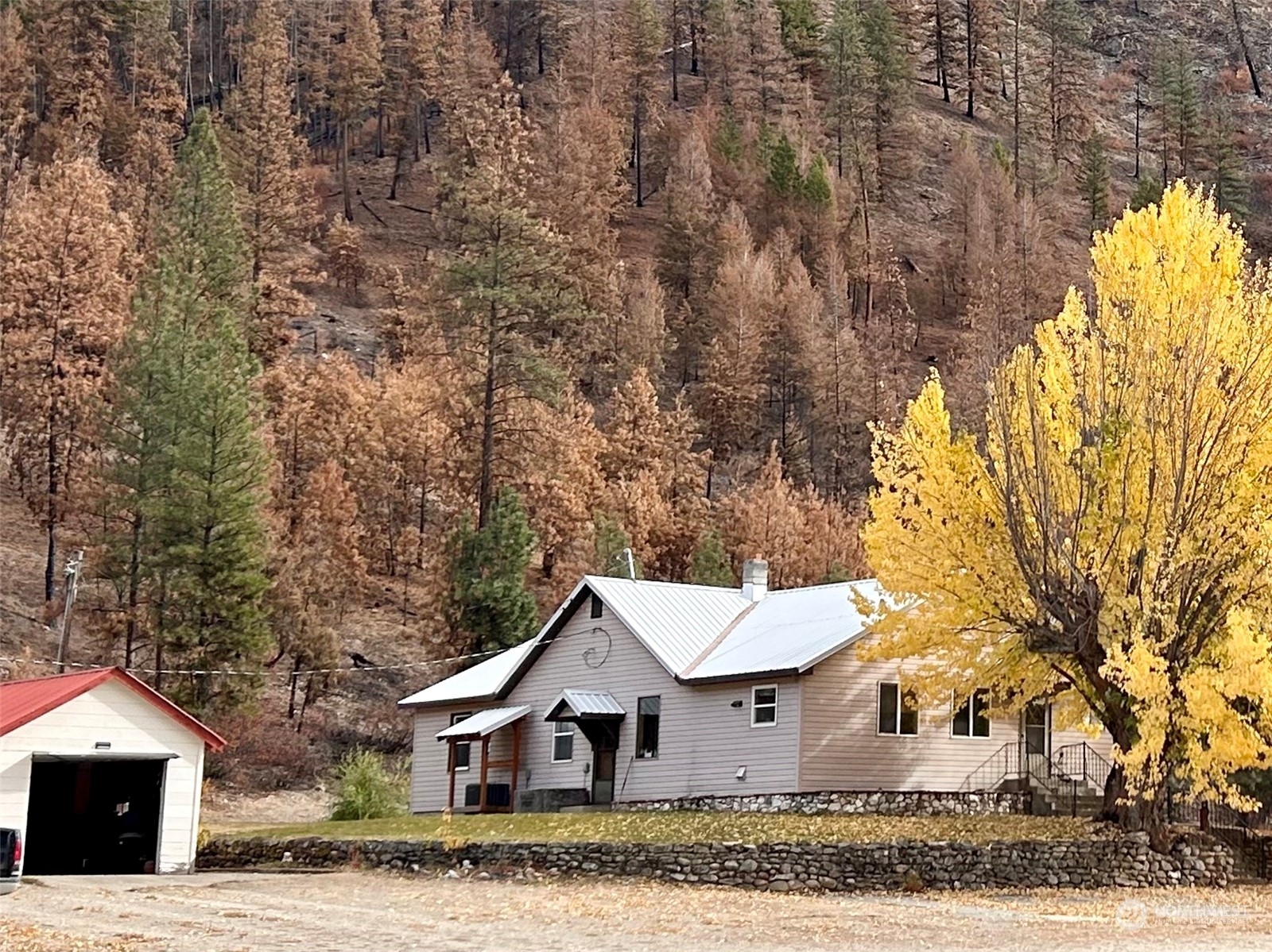 a view of house with a yard